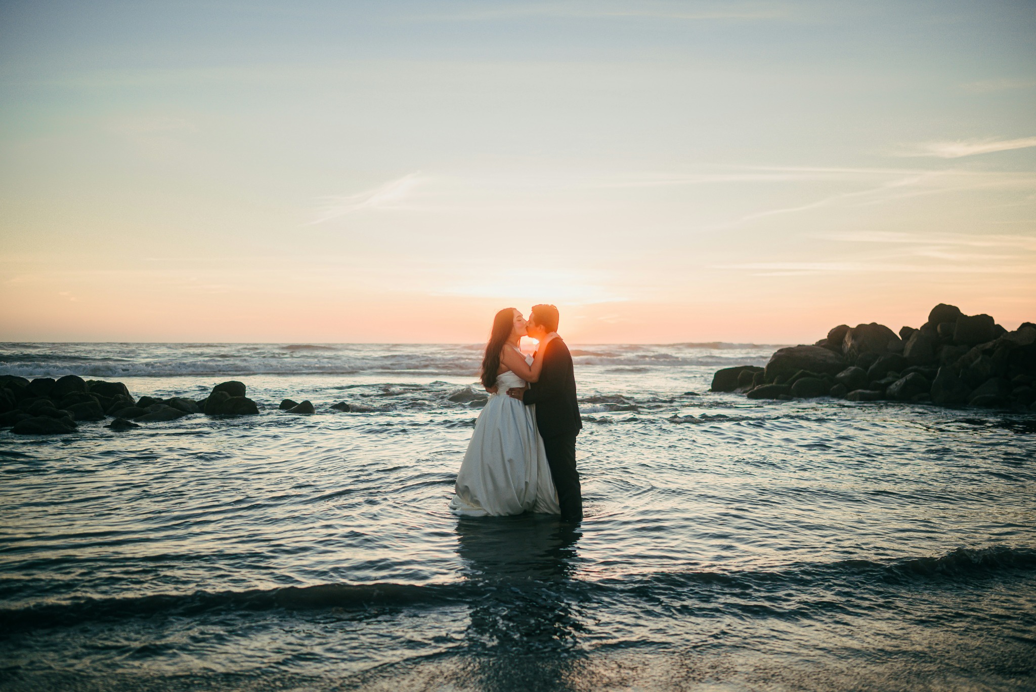 A couple enjoying a romantic moment by the sea