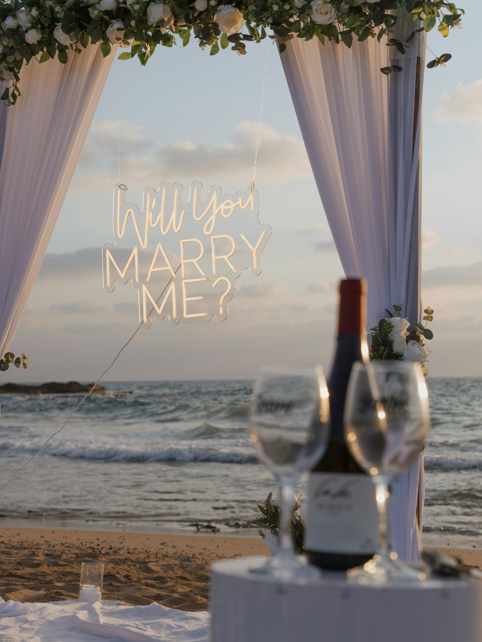 Romantic proposal setup beside the ocean